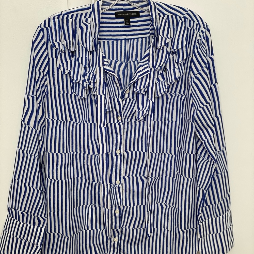 Banana Republic button down shirt/blouse with ruffles and tie at top.